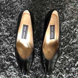 Blk patent leather w/ snake skin texture heels.